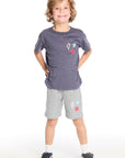 Full body view of the Chaser Kids Bolt Star Smiley Tee in Avalon Blue with colorful design paired with the matching Heather Grey Bolt Star Smiley Shorts on a white background