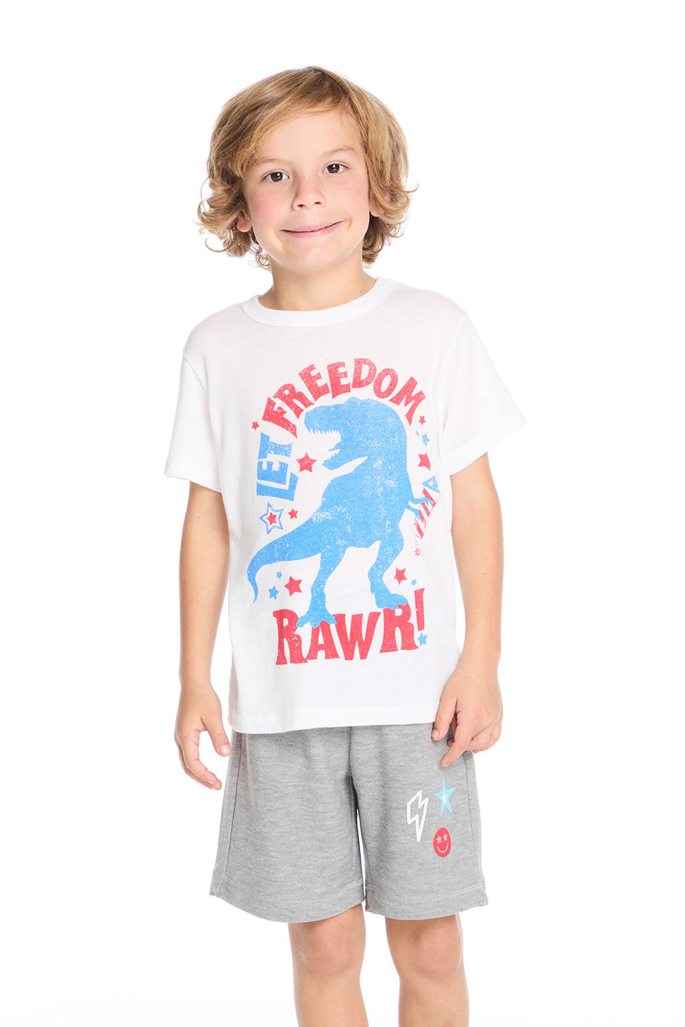 Front view of Chaser Kids Let Freedom Roar Tee in White featuring red and blue dinosaur graphic with patriotic stars