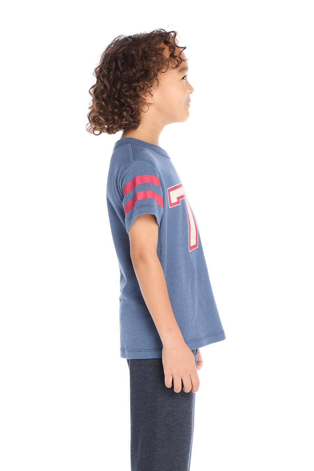 Side view of Chaser Kids 76 Classic Tee showing red sleeve stripes and soft cotton-blend jersey fabric