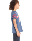 Side view of Chaser Kids 76 Classic Tee showing red sleeve stripes and soft cotton-blend jersey fabric