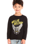 Boy wearing Chaser’s Willie Nelson Willie 1978 black long sleeve with ‘Willie Nelson’ and eagle graphic design on a white background