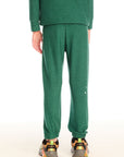 Back view of boy wearing Chaser’s Greatest Of All Time Everest Green pants with matching long sleeve top on a white background