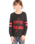 Boy wearing Chaser’s Best Brother Ever black long-sleeve shirt with red text and striped sleeves, paired with blue jeans on a white background