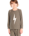 Boy wearing Chaser’s Bolt safari green long sleeve top with lightning bolt design and matching pants on a white background.