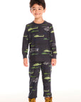 Boy wearing Chaser's dark gray Allover Helicopters long-sleeve shirt and matching pants with helicopter patterns on a white background