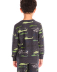 Boy view of boy wearing Chaser's dark gray Allover Helicopters long-sleeve shirt and matching pants with helicopter patterns on a white background