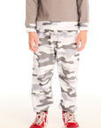 Boy wearing Chaser’s Camo Pants in gray camouflage on a white background.