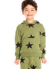 Boy wearing Chaser's Allover Stars green hoodie and matching pants with black star patterns on a white background