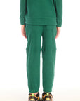 Back view of boy wearing Chaser’s Everest Green Knee Seam Jogger with seam detail on a white background