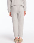 Back view of boy wearing Chaser’s heather grey Knee Seam Joggers with waffle texture against a white background