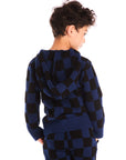Back view of boy wearing Chaser’s Paxton blue and black checkered zip up hoodie with matching pants on a white background