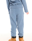 Back view of boy wearing Chaser’s Lounge Tahoe Blue Pant with Pocket with matching zip up hoodie on a white background