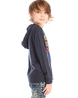 Side view of boy wearing Chaser’s Hockey navy blue pullover hoodie with ‘Hockey’ text detail against a white background