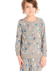 Boy wearing Chaser's gray Allover Ski Slope long sleeve and matching pant with colorful patterns on a white background