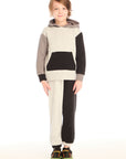 Full body front view of boy wearing Chaser’s Colorblocked Lounge Pant with matching color-blocked long sleeve hoodie on a white background