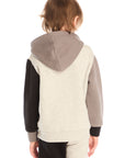 Back view of boy wearing Chaser’s color-blocked long sleeve hoodie with matching pants on a white background