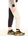 Side view of boy wearing Chaser’s Colorblocked Lounge Pant with clean silhouette and relaxed fit on a white background