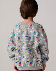 Model wearing Chaser's Dolomiti Boys Pullover in heather grey with distinctive graphic and design details, back view
