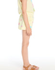 Side view of the Chaser Kids Colorful Shells Shorts in Pale Nectar showing elastic waistband and playful allover shell print on a white background