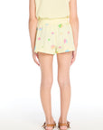 Back view of the Chaser Kids Colorful Shells Shorts in Pale Nectar highlighting the easy pull-on fit and colorful seaside print on a white background