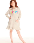 Full body view of girl wearing Chaser’s Glitter Smiley Heather Grey Hoodie Dress with long sleeves, colorful “HAPPY” letters on the front against a white background