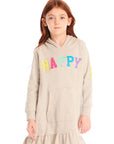 Girl wearing Chaser’s Glitter Smiley Heather Grey Hoodie Dress with long sleeves and colorful letters spelling “HAPPY” on the front against a white background