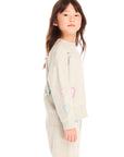 Side view of girl wearing Chaser’s light gray Winter Love Stitches Long Sleeve with colorful designs on a white background