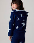 Model wearing Chaser's Allover Stars Girls Pants in lake blue with star detailing, additional view