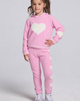 Chaser Kids Holiday Hug Girls Hoodie and Holiday Hug Girls Pants in pink with white hearts, full-body front view against a light gray studio background