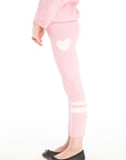 Side view of girl wearing Chaser’s pink Slim Confetti Legging with heart print on a white background
