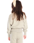 Back view of girl wearing Chaser’s Danni Heather Grey Pullover with matching Tara Leggings on a white background