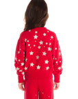 Back view of girl wearing Chaser’s Danni Rouge Pullover with star patterns and matching Tara Leggings on a white background