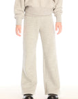 Girl wearing Chaser’s Tara Heather Grey Leggings with matching Danni Pullover on a white background