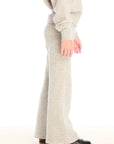 Side view of girl wearing Chaser’s Tara Heather Grey Leggings with matching Danni Pullover on a white background