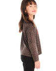 Side view of girl wearing Chaser’s Blondie Leopard & Hearts print pullover top with red text on a white background
