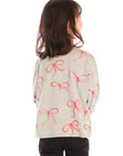 Back view of girl wearing Chaser’s gray Red Bows Long Sleeve with pink bow pattern on a white background