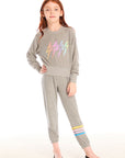 Full body view of girl wearing Chaser’s Heather Grey Contrast Strappings Pants with colorful accents on the left leg and Rainbow Bolts pullover on a white background