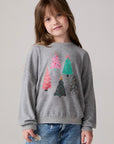 Model wearing Chaser's Festive Trees Girls Pullover in heather grey with distinctive graphic and design details, front view