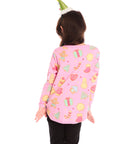 Back view of girl wearing Chaser’s pink Tossed Candy Canes Long Sleeve with allover candy cane design and a Christmas tree hat on a white background