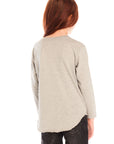 Back view of girl wearing Chaser’s Heather Grey Colorful Smileys long sleeve pullover and black jeans on a white background