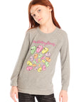 Girl wearing Chaser’s gray The Rolling Stones Spiral Tongues Long Sleeve with colorful logo designs and text on a white background