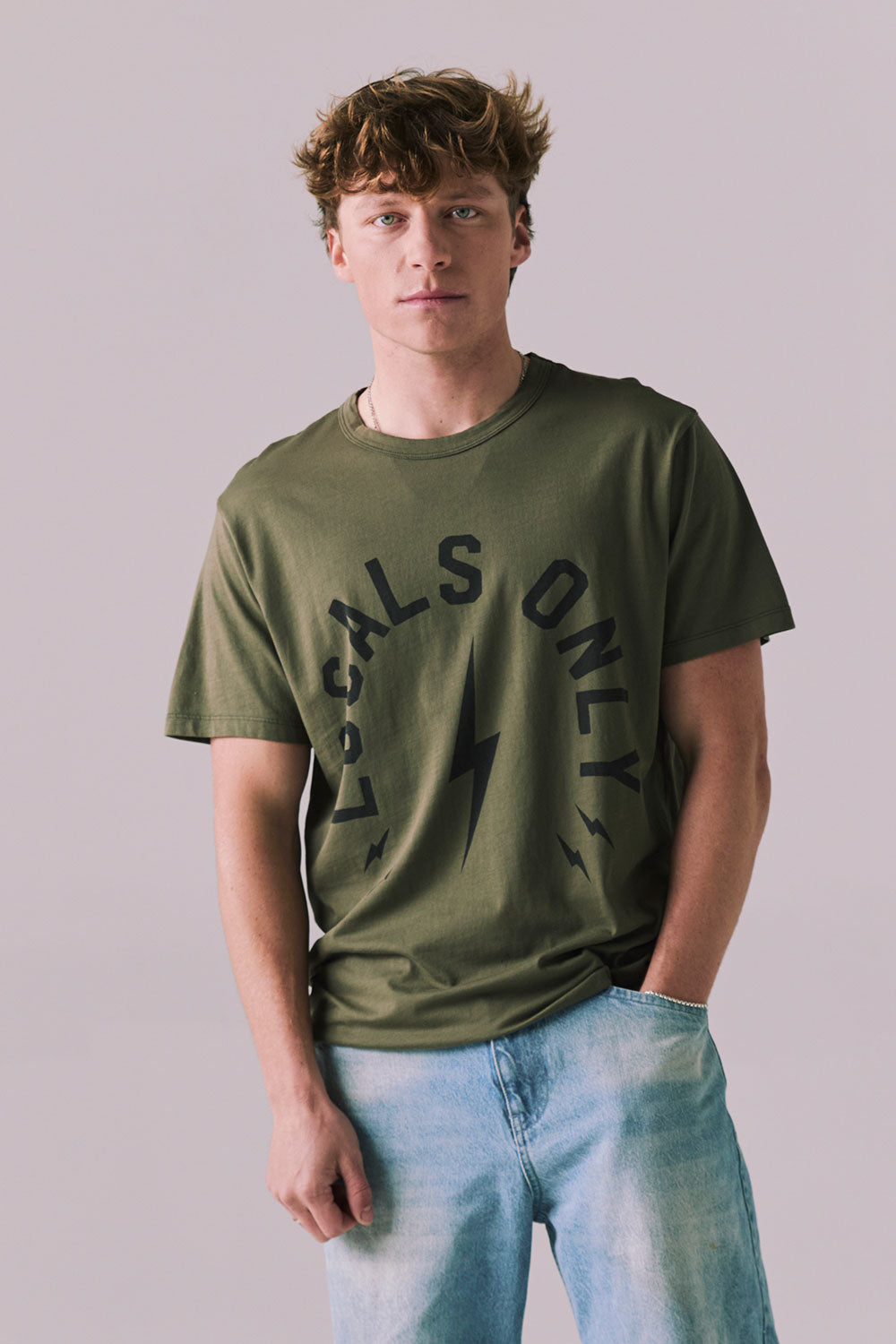 Front view of Locals Only tee in Backwoods Green with retro graphic.