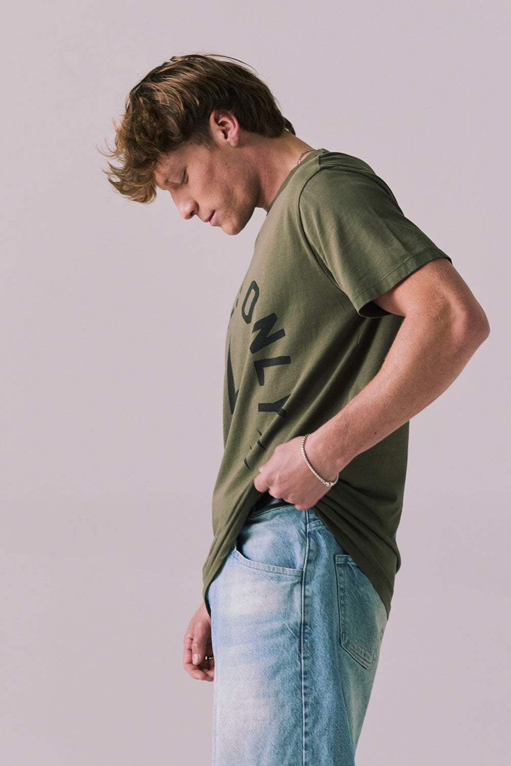 Side view of vintage-style Locals Only tee in Backwoods Green.