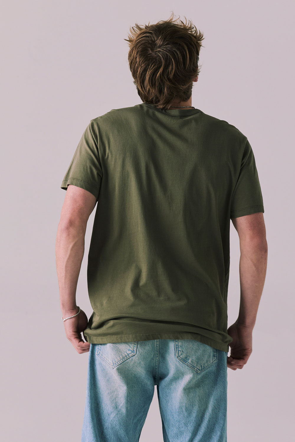 Back of Locals Only tee in Backwoods Green with clean finish.