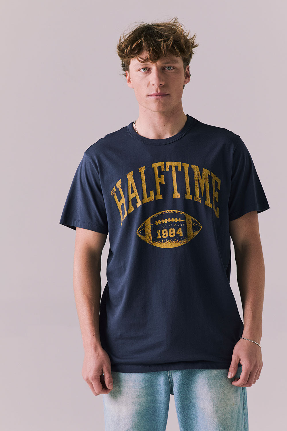 Front view of Halftime 1984 tee in navy with bold athletic graphic.