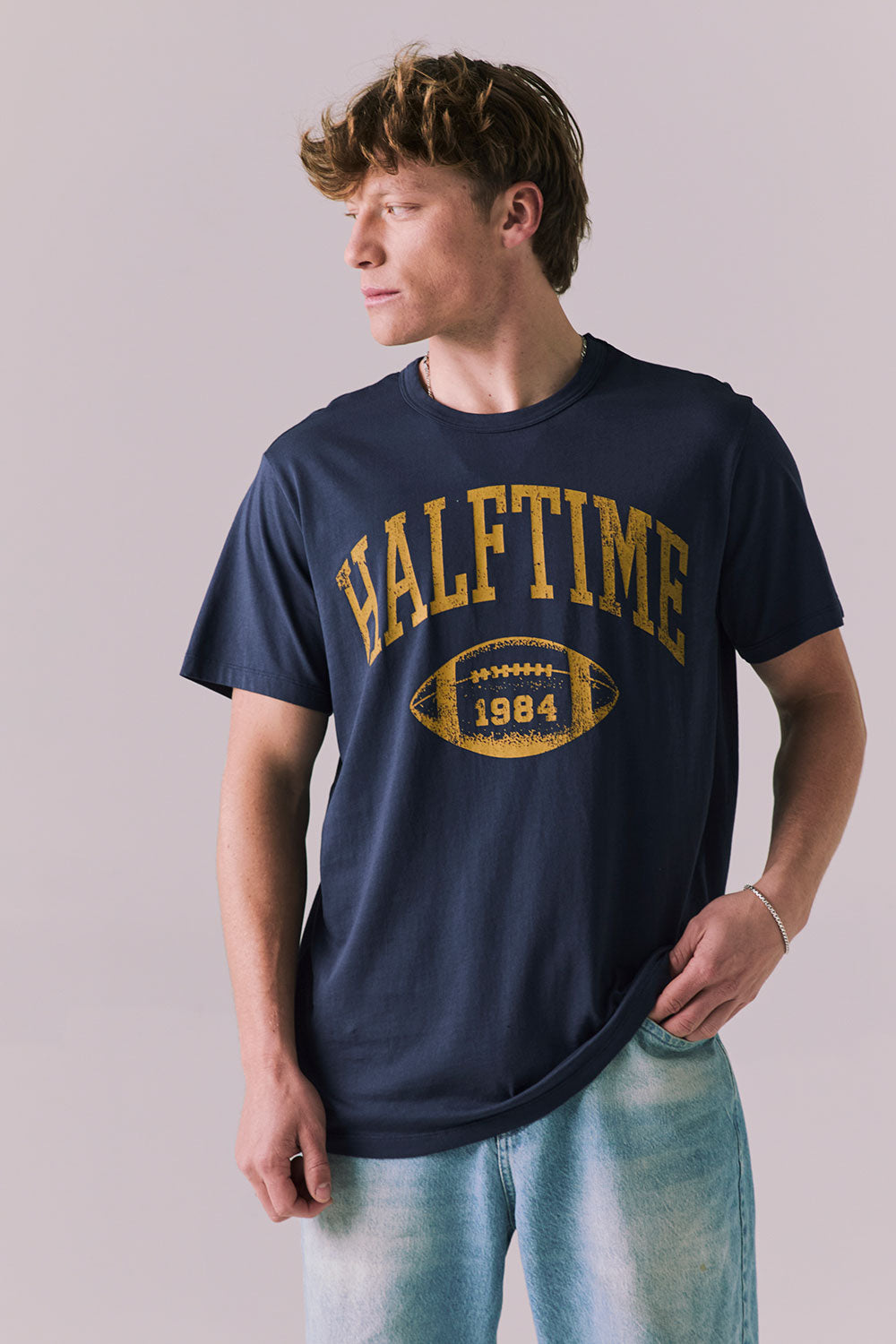 Front view of Halftime 1984 tee in navy with bold athletic graphic.