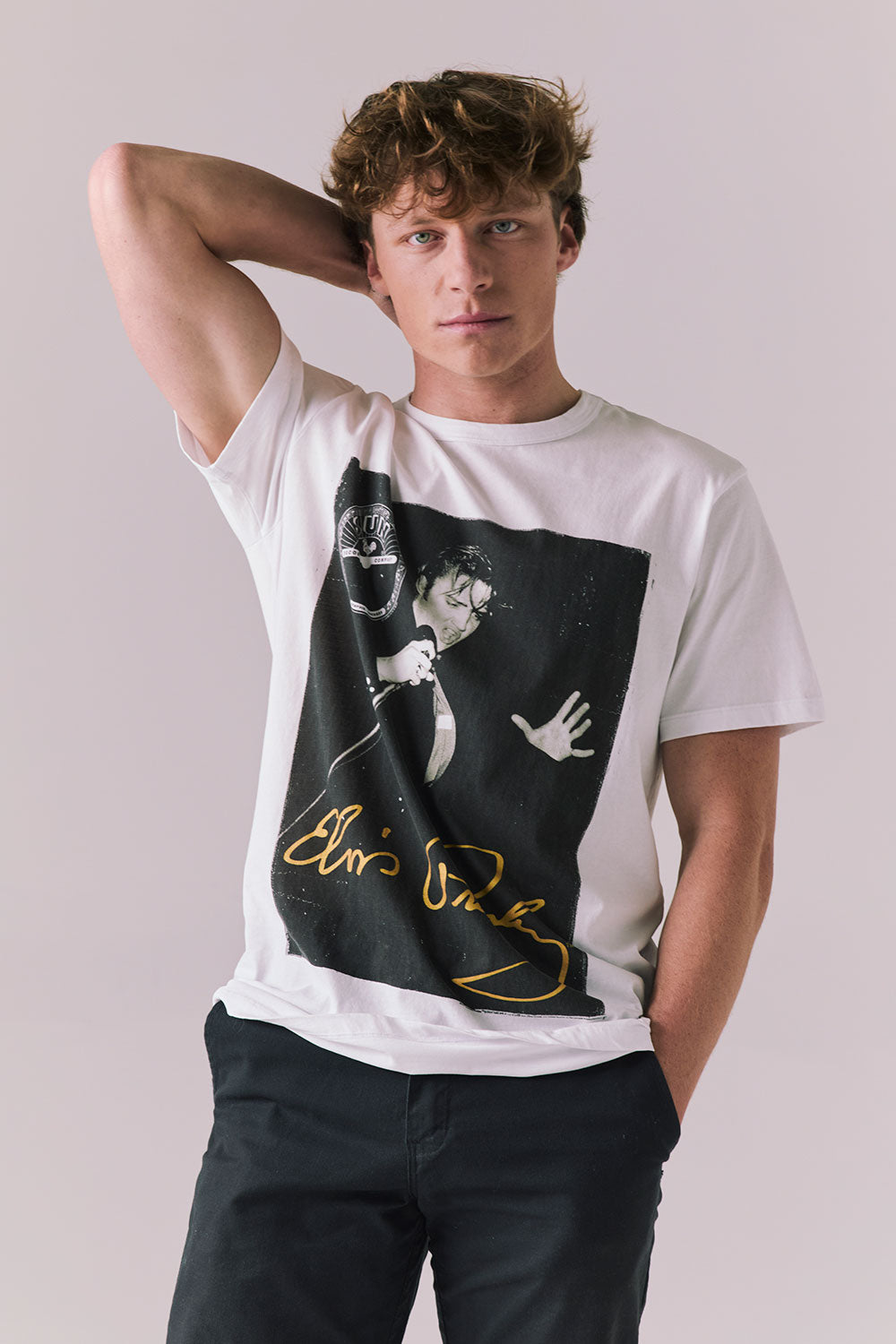 Front view of Elvis Live Portrait tee in white with Sun Records artwork.
