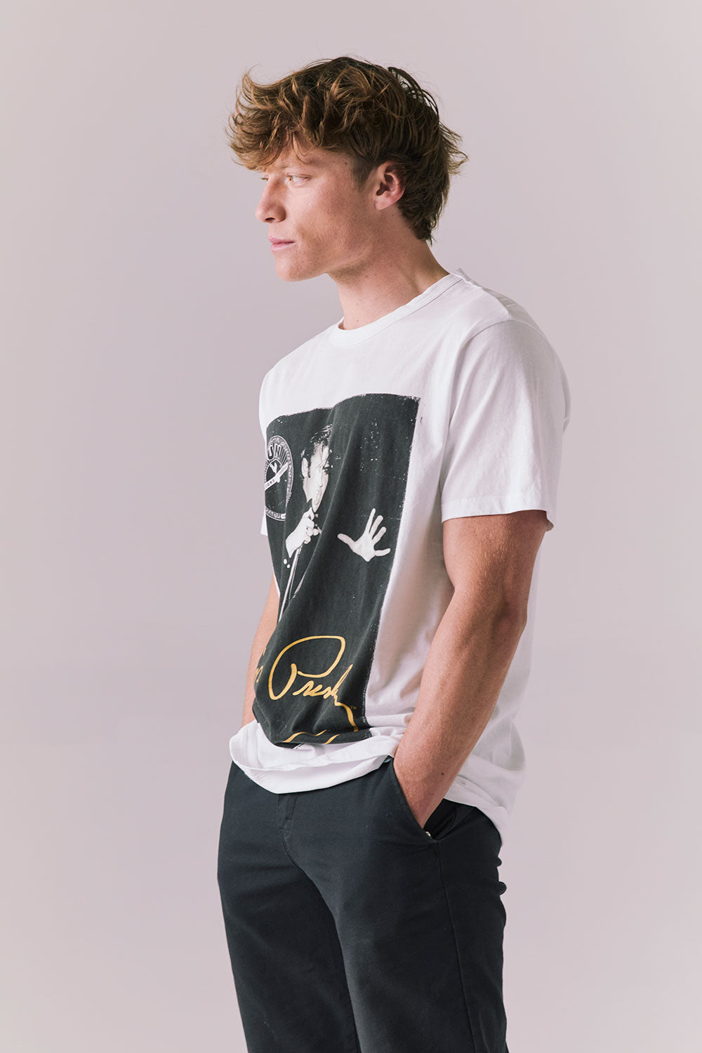 Side view of white Sun Records Elvis tee with retro graphic.