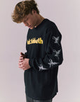 Side angle of vintage-style long sleeve band tee in true black.