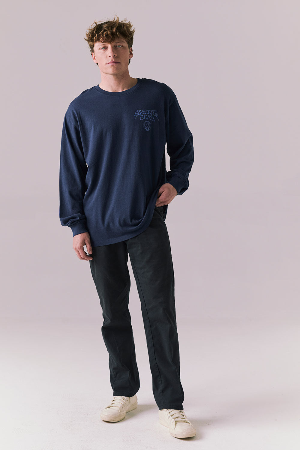 Model wearing full Grateful Dead long sleeve tee in Dark and Stormy Blue.